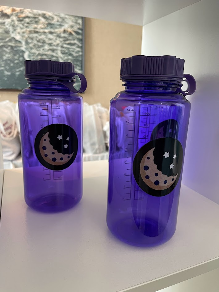 Insomnia Cookies branded purple water bottles